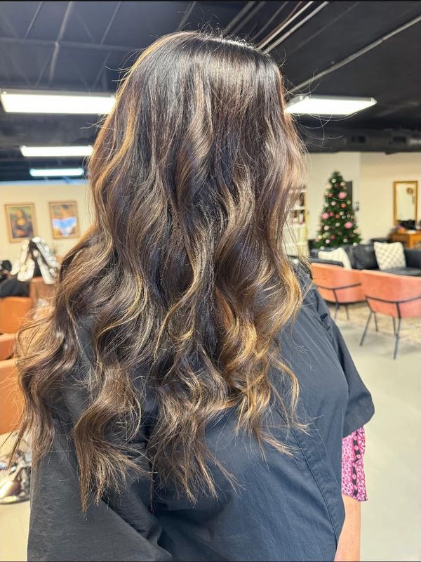 Bright blonde lived-in color with curls
